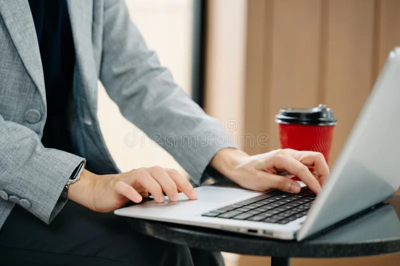 Bright modern office desk with laptop and smartphone ready for a friendly conversation