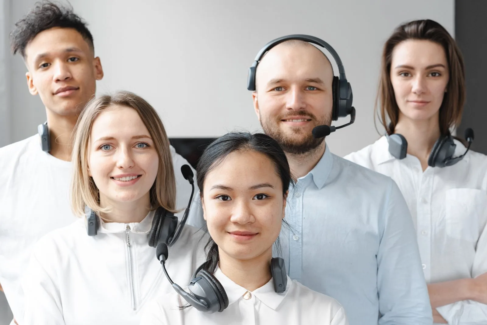Friendly customer support specialist answering client questions in a bright modern office